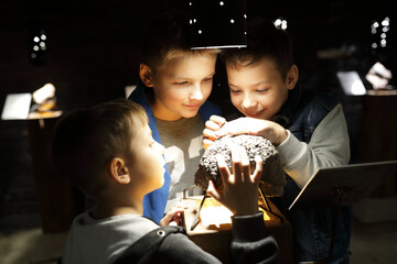 Children studying natural mineral