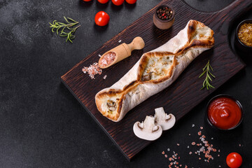 Delicious fresh street pizza with chicken, mushrooms and cheese