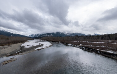 Snow covered Columbia River Valley near Rivelstock Canada overcast day