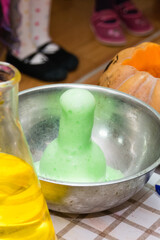 Experiments with chemistry for children during the halloween celebration
