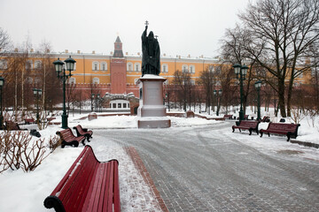 Monument to Patriarch Hermogenes in Alexander garden in the fog. Misty winter morning in Moscow.