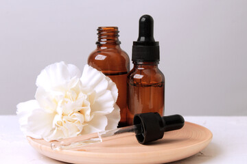 Brown glass bottle with serum, essential oil or other cosmetic product.