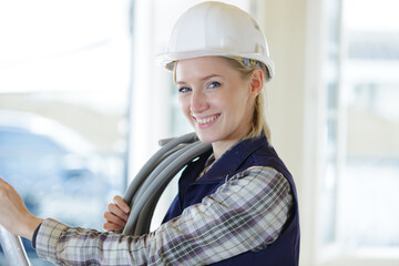 portrait of an electrician woman at work