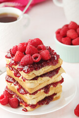 Sandwiches with peanut butter and raspberry jam