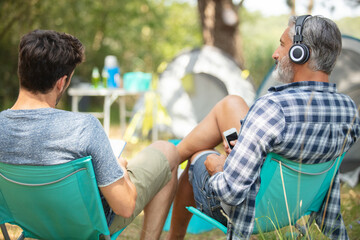 two men at a campsite