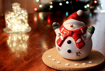 christmas lamp snowman on the background of christmas tree lights