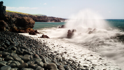 a lone river rock-strewn shoreline along Maui's Southeastern coastline. 