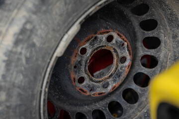 Visible inner flat part of steel rim or wheel, place where rim touches the hub of a car.