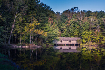 Covered foot bridge over lake