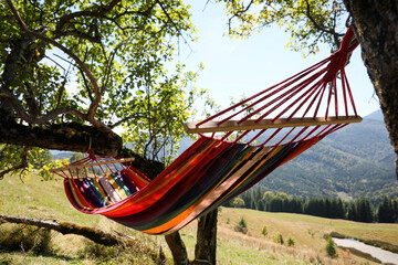 Obraz na płótnie Canvas Empty comfortable hammock in mountains on sunny day