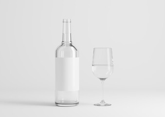 Blank transparent wine bottle with glasses on the empty background