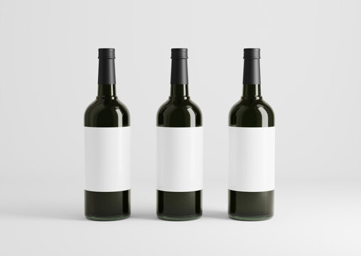Blank black wine bottle with glasses on the empty background