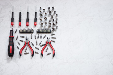 Universal screwdriver set with replaceable bits on a light background.