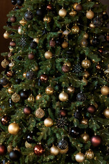Christmas tree. Home decorations. Christmas glass balls, toys and lights.