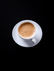 Cup of coffee on black background. Copy space.