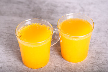 tea with sea buckthorn in glass mugs