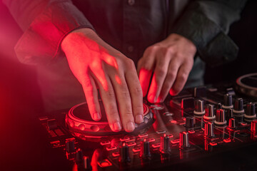 DJ remote control and headphones. Digital multimedia composition gadget
