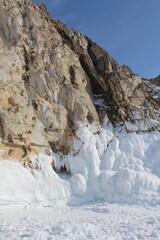 Fototapeta na wymiar Baikal lake in winter. Ice formations, icicles, snow landscape