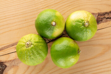 Several fragrant bergamots on a wooden table, close-up, top view.