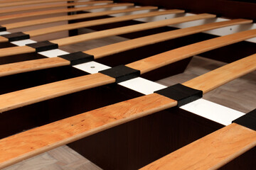 Close-up of a bed base made of wooden overhead slats - obrazy, fototapety, plakaty