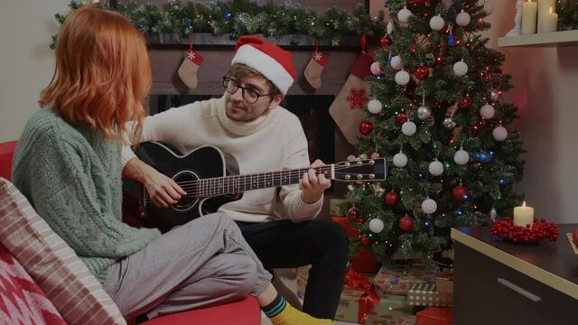 Couple singing laughing together Christmas holiday