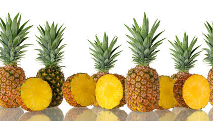 Collection of pineapples on a Isolate background. Fresh juicy tropical yellow fruit with green leaves. Summer food concept