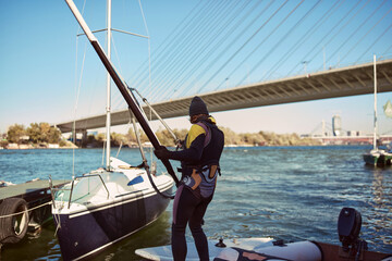 Windsurfer surfing on a windy day at the river.