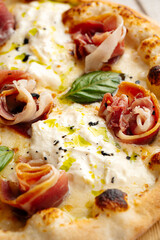 Closeup on gourmet prosciutto pizza texture background