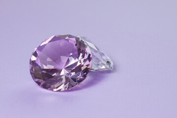 Purple precious gemstones for design gems jewellery. Diamonds crystal on turquoise background.