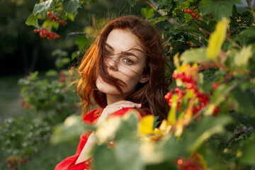 beautiful woman bush with berries nature fresh air