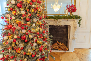 Classic Christmas decorated interior room, New year tree with red and gold decorations. Modern white classical style interior design apartment with fireplace and Christmas tree. Christmas eve at home.