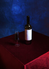 Retro composition with a glass of red wine against a textured blue wall. The concept of a wild vintage Halloween or Thanksgiving party. conceptually, in the style of minimalism.stylish interior design