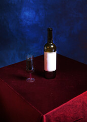 Retro composition with a glass of red wine against a textured blue wall. The concept of a wild vintage Halloween or Thanksgiving party. conceptually, in the style of minimalism.stylish interior design