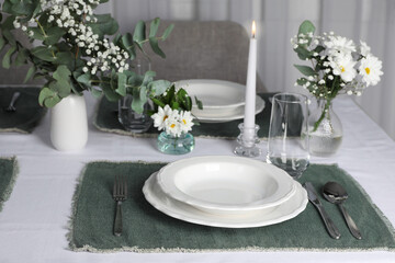 Elegant festive setting with floral decor on table