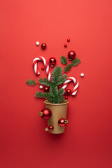 Christmas card with Christmas ornaments on red background