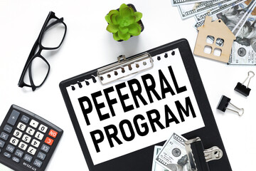REFERRAL PROGRAM. black clipboard, with a white sheet of paper on a white background. black glasses. calculator. business concept