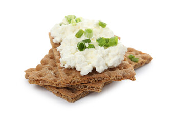 Crispy crackers with cottage cheese and green onion on white background