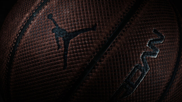 Nike Air Jordan basketball with Jumpman logo. Low key illustrative editorial photo