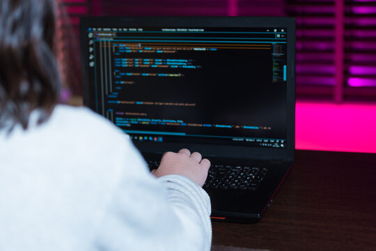 Teenager programming a web page.
