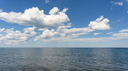 Summer lake with partly cloudy sky