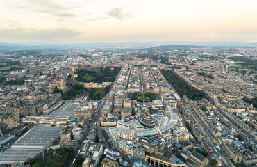 Aerial view of Edinburgh in the morning sunrise. Sunlight, a breathtaking view of the Georgian architecture of Edinburgh fills the screen in this aerial shot. Travel and explore the Scottish capital