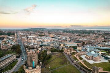 Aerial view of Edinburgh in the morning sunrise. Sunlight, a breathtaking view of the Georgian architecture of Edinburgh fills the screen in this aerial shot. Travel and explore the Scottish capital