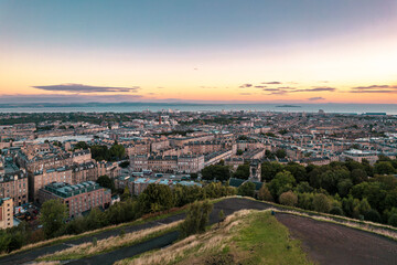 Aerial view of Edinburgh castle looms overlooking the Old Town. Edinburgh Castle is one of the most important and historic castles in Scotland. Edinburgh Castle has been Edinburgh's dominant landmark