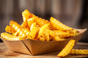 french fries on a wooden table