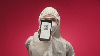 Woman doctor in uniform show on phone vaccination passport with qr code, international coronavirus covid 19 vaccine certificate on mobile device, green zone. 