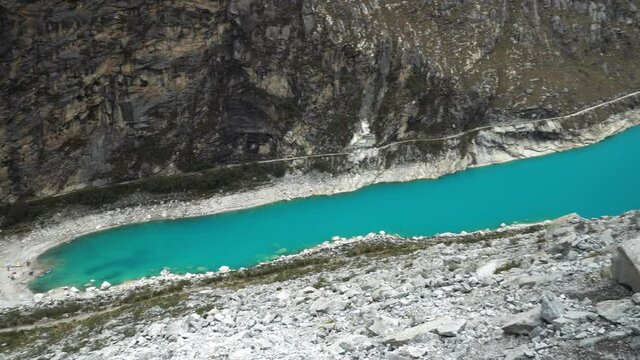 Panning of the beautiful turquoise Paron lagoon seen from above in the day