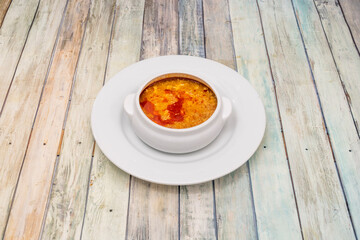 White bowl with Castilian soup, centuries old food recipe