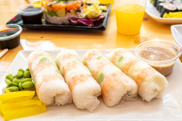 Cristal Japanese rolls filled with rice, cooked prawns and edamame beans with mango