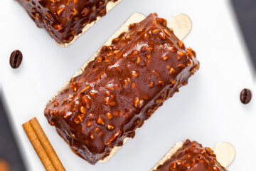 cake with peanuts poured with chocolate c