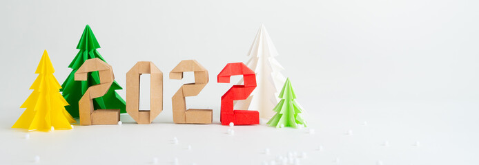 Christmas decoration, Close up of a colorful origami christmas tree set with numbers year 2022...